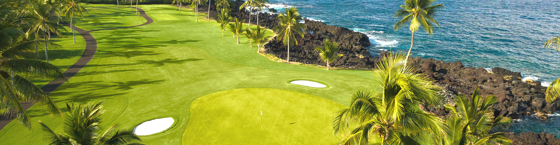 aerial view of golf course green on the shoreline
